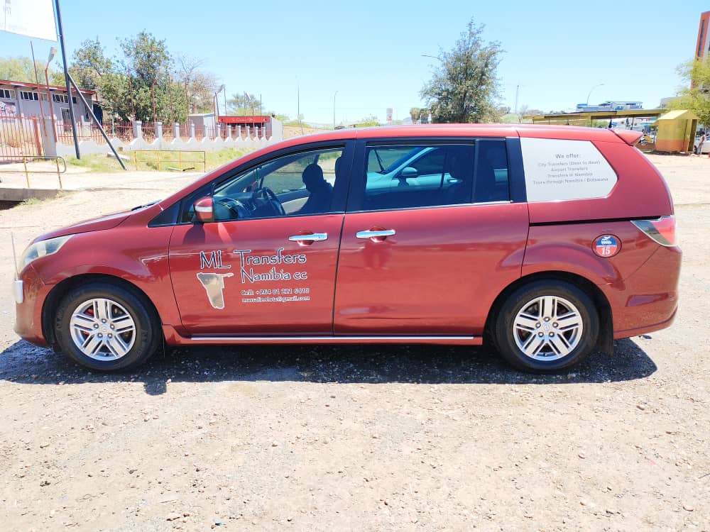 M·L Transfer van, side profile in town